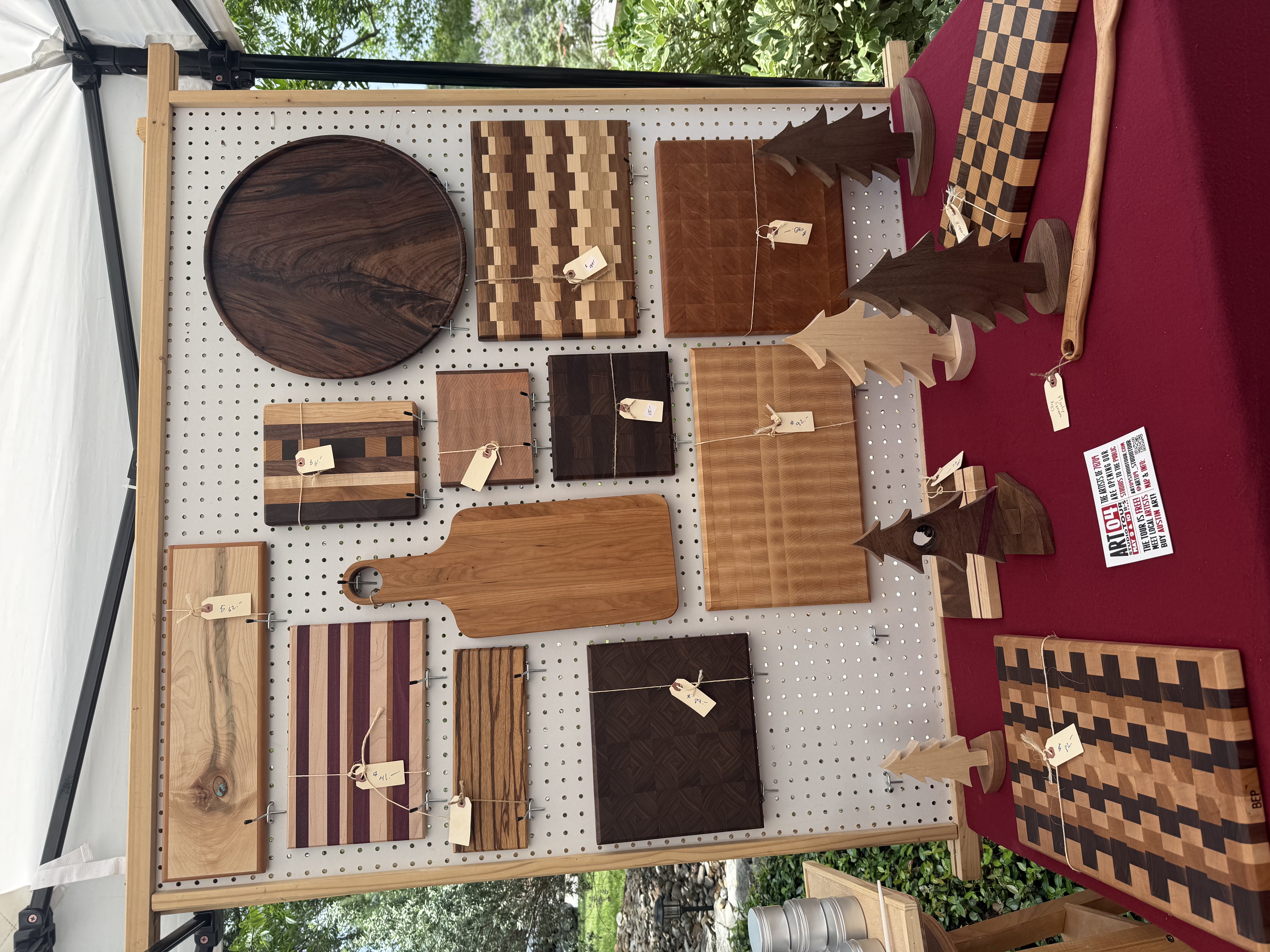 ART04 booth display with cutting boards and small wooden Christmas trees