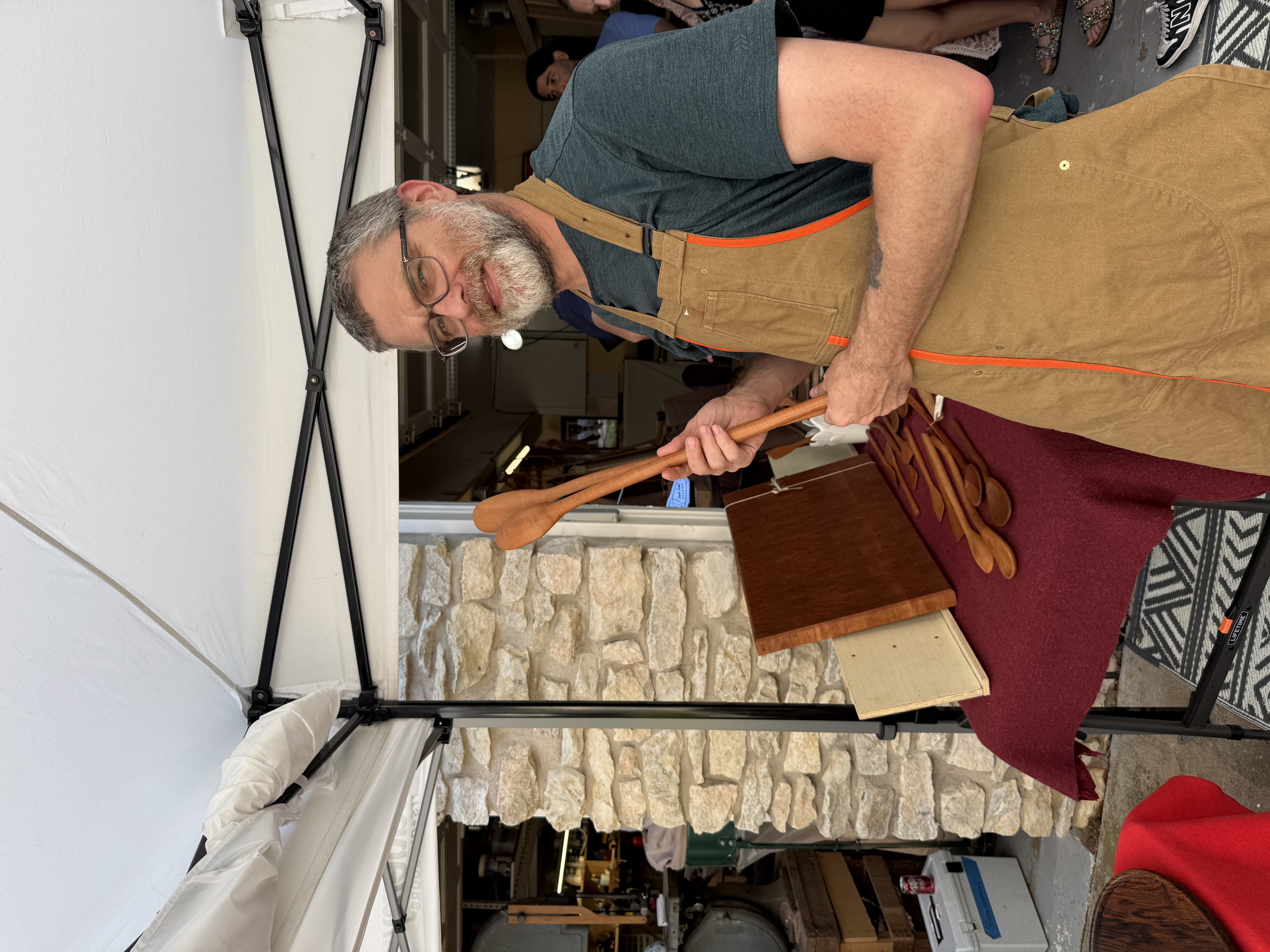 John Pruitt holding a long-handled spoon